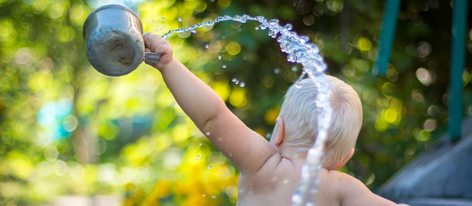 Baby playing in water | Life Insurance